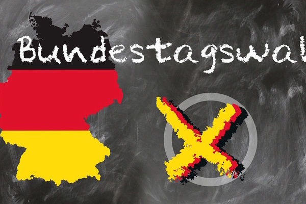 Zeichnung der Bundesrepublik in Schwarz Rot Gold, weiße Überschrift Bundestagswahl mit gelbem Kreuz gekennzeichnerter Kreis Zeichnung der Bundesrepublik in Schwarz Rot Gold, weiße Überschrift Bundestagswahl mit gelbem Kreuz gekennzeichnerter Kreis
